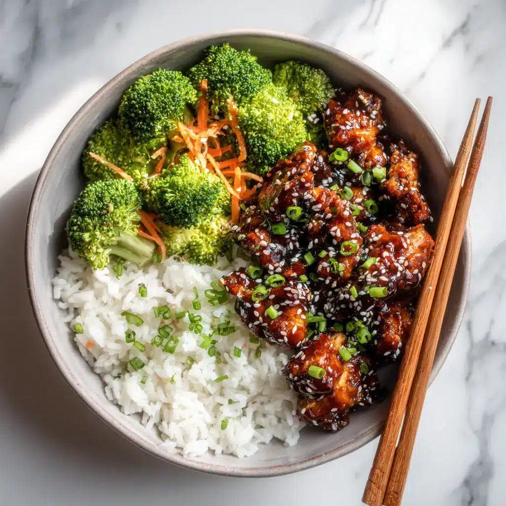 A close-up action shot of the teriyaki chicken being sautéed in a pan with the glistening, homemade teriyaki sauce.