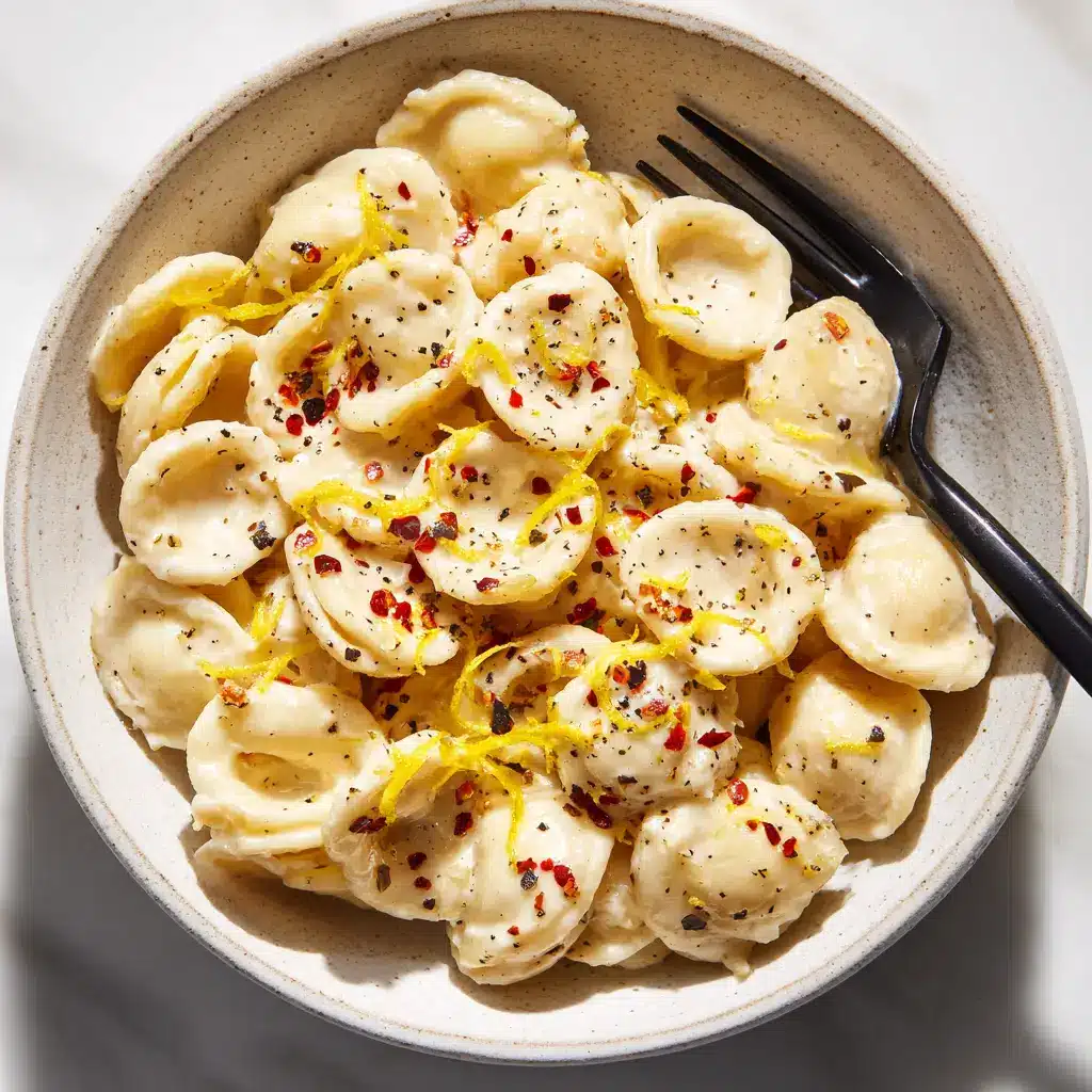 A bowl of homemade pasta with a creamy white sauce, garnished with herbs. This shows the final step in making the best roasted garlic pasta sauce.