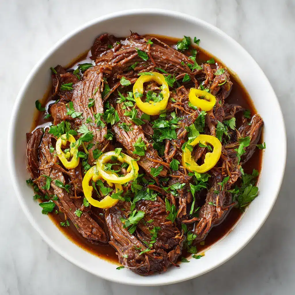 A serving of pepperoncini pot roast on a plate with mashed potatoes, showcasing a delicious way to enjoy the meal.