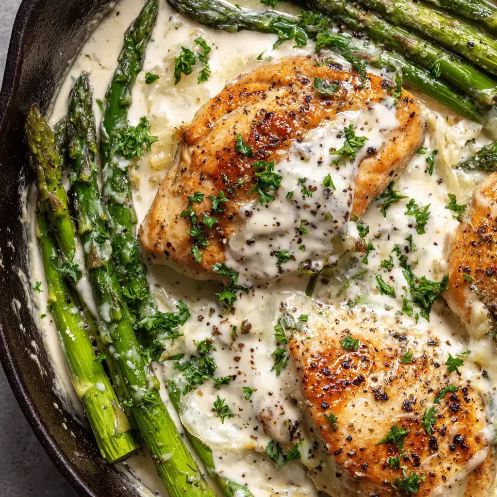 Creamy Baked Chicken and Asparagus 2 Close-up of freshly seared golden-brown chicken and blistered asparagus ingredients before making the cream sauce.