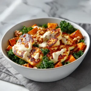 A close-up shot of the components of the sweet potato halloumi salad, showing the crispy chickpeas and tender roasted sweet potatoes before being assembled.