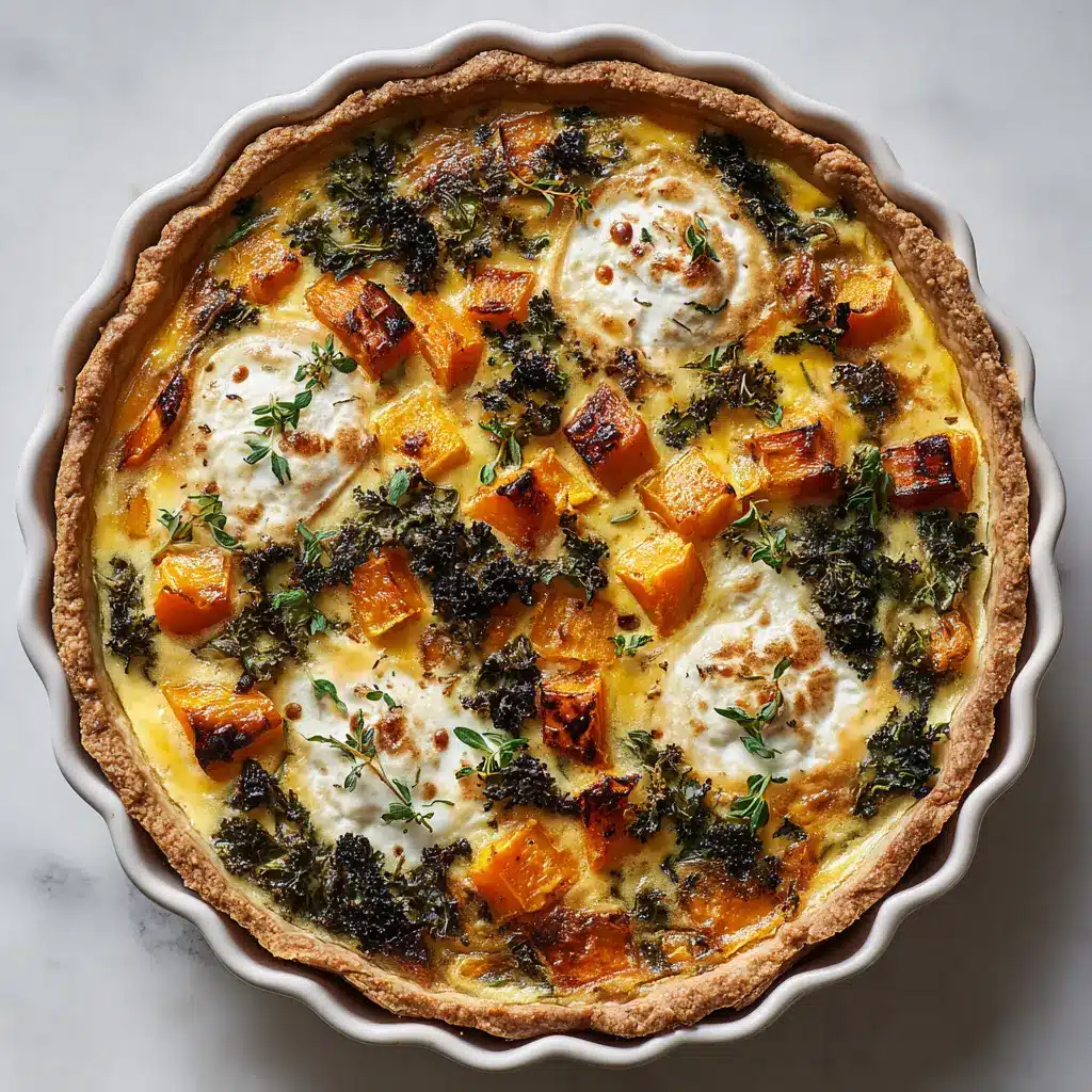 A whole baked winter vegetable quiche in a round fluted white ceramic pan, showing the flaky crust and colorful filling of squash, kale, and ricotta, garnished with thyme.