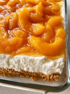 Close up of the uniform bright white cream cheese layer in an Amish Peach Delight.